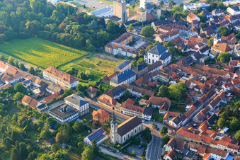 Neumayerstraße with the Catholic Church of St. Peter, the Catholic Parish Office of St. Anna and the Tax Office of Worms-Kirchheimbolanden as well as the Paulskirche at the castle Kirchheimbolanden, now a senior citizens' residence Kirchheimbolanden in Kirchheimbolanden in the state Rhineland-Palatinate, Germany