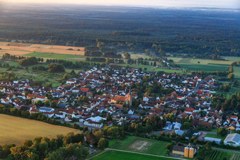 Village view in the morning from the north with Catholic Church of St. Leodegar in Steinfeld in the state Rhineland-Palatinate, Germany