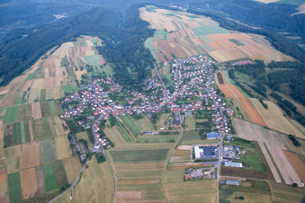 Aerial photograpy of Village - view on the edge of agricultural fields and farmland in Donsieders in the state Rhineland-Palatinate