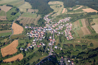 Village - view on the edge of agricultural fields and farmland in Frohnhofen in the state Rhineland-Palatinate, Germany