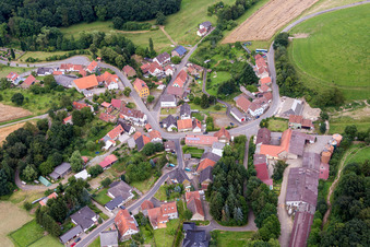 Village - view on the edge of agricultural fields and farmland in Reichsthal in the state Rhineland-Palatinate, Germany