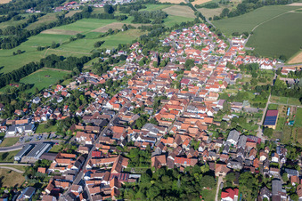 Aerial view of Village - view on the edge of agricultural fields and farmland in Rohrbach in the state Rhineland-Palatinate, Germany