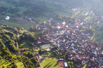 Village - view on the edge of agricultural fields and farmland in Leutenbach in the state Bavaria, Germany