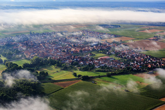 Village view with morning mist from the southwest in Rohrbach in the state Rhineland-Palatinate, Germany