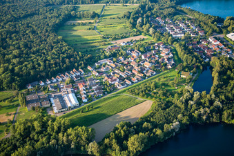 Village on the lake bank areas of lake for gravel mining near the river Rhine in the district Grauelsbaum in Lichtenau in the state Baden-Wurttemberg, Germany