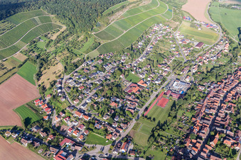 Aerial photograpy of Village - view on the edge of agricultural fields and farmland in Schuetzingen in the state Baden-Wurttemberg, Germany