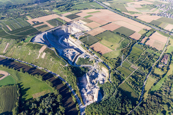 Aerial view of Mundelsheim quarry for the extraction and production of grit behind vineyards on the Neckar in the district Höpfigheim in Steinheim an der Murr in the state Baden-Wuerttemberg, Germany