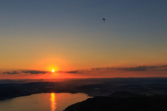 Sunset over Lake Überlingen with paraglider in Bodman-Ludwigshafen in the state Baden-Wuerttemberg, Germany