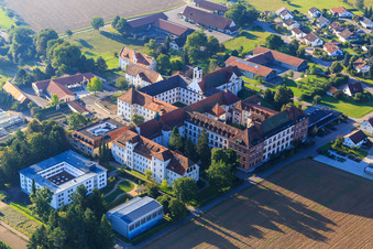Aerial view of Monastery and monastery church Sießen with vegetable garden, café in the monastery courtyard and parish church of St. Markus in the district Sießen in Bad Saulgau in the state Baden-Wuerttemberg, Germany