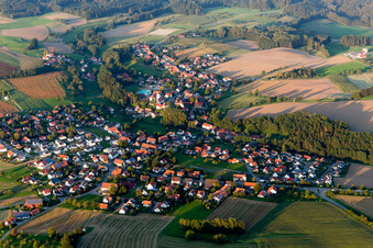 Aerial view of Village - view on the edge of agricultural fields and farmland in Herdwangen-Schoenach in the state Baden-Wurttemberg, Germany