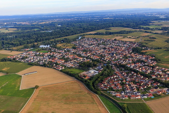 Village view on the Rhine dam from the north in Leimersheim in the state Rhineland-Palatinate, Germany