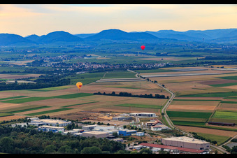 Aerial view of 2 hot air balloons towards Insheim in Herxheim bei Landau in the state Rhineland-Palatinate, Germany
