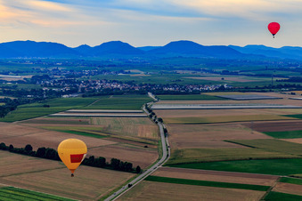 Aerial photograpy of 2 hot air balloons towards Insheim in Herxheim bei Landau in the state Rhineland-Palatinate, Germany