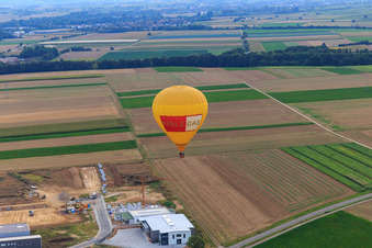 Hot air balloon PFALZGAS over the W II industrial park in Herxheim bei Landau in the state Rhineland-Palatinate, Germany