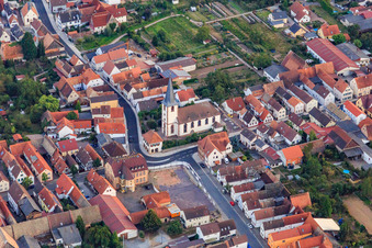 Church and village square with Malteser Hilfsdienst gGmbH, VR Bank Südpfalz eG branch Ottersheim in Ottersheim bei Landau in the state Rhineland-Palatinate, Germany