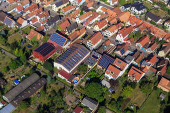 Barns with PV roofs on Rheinstr in Kandel in the state Rhineland-Palatinate, Germany seen from a drone