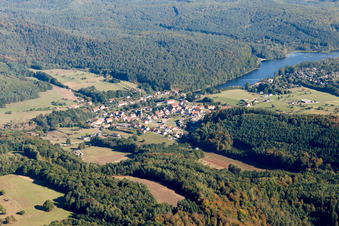 Aerial view of Village on the lake bank areas of Etang de Haspelschiedt in Haspelschiedt in Grand Est, France
