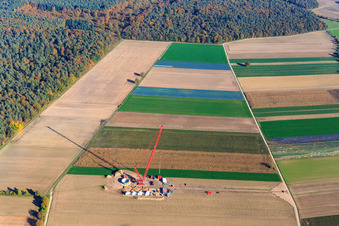 Construction site at the wind turbine foundation with crane in the wind farm Hatzenbühl in Hatzenbühl in the state Rhineland-Palatinate, Germany from above