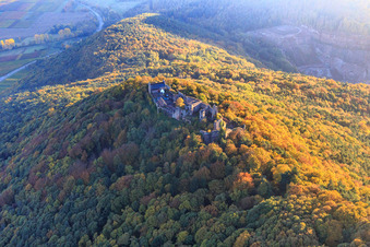 Madenburg castle ruins in the autumn forest at evening light in Eschbach in the state Rhineland-Palatinate, Germany