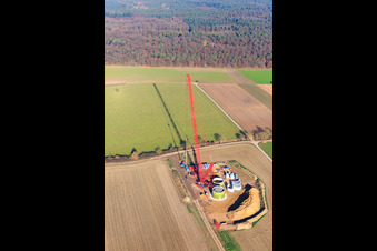 Oblique view of Construction site wind turbine foundation with crane in Hatzenbühl in the state Rhineland-Palatinate, Germany