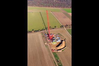 Construction site wind turbine foundation with crane in Hatzenbühl in the state Rhineland-Palatinate, Germany from above