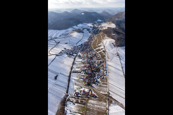 Aerial view of Wintry snowy Village - view on the edge of snowed wine yards in Ranschbach in the state Rhineland-Palatinate, Germany