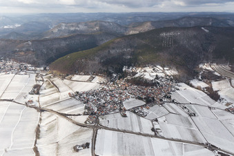 Wintry snowy Village - view on the edge of agricultural fields and farmland in Gleisweiler in the state Rhineland-Palatinate, Germany