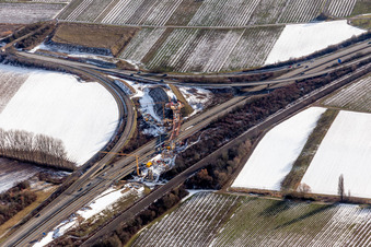 Wintry snowy Routing and traffic lanes over the highway bridge in the motorway A 65 in Landau in der Pfalz in the state Rhineland-Palatinate, Germany