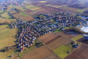 Village overview in winter with little snow from the northwest in Knittelsheim in the state Rhineland-Palatinate, Germany