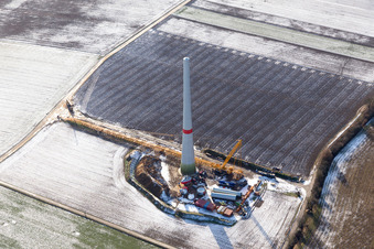 Aerial view of Wintry snowy Construction site for wind turbine installation in Hatzenbuehl in the state Rhineland-Palatinate, Germany