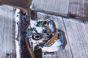 Oblique view of Wintry snowy Construction site for wind turbine installation in Hatzenbuehl in the state Rhineland-Palatinate, Germany