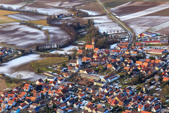 Two churches in Herrengasse in winter with little snow from the southeast in Minfeld in the state Rhineland-Palatinate, Germany