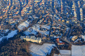 City overview in winter with little snow from the west with spa park Bad Bergzabern at the Edith Stein Clinic in Bad Bergzabern in the state Rhineland-Palatinate, Germany