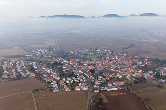 Village - view below clouds on the edge of agricultural fields and farmland in the district Moerzheim in Landau in der Pfalz in the state Rhineland-Palatinate, Germany