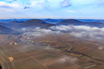 Village view on the edge of the Haardt in winter with low clouds from the east in Leinsweiler in the state Rhineland-Palatinate, Germany