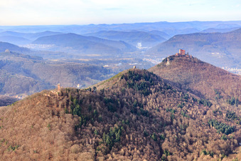 Aerial view of The four castle ruins Scharfenberg, Jungturm, Anebos and Trifels Castle in winter from the southeast in Leinsweiler in the state Rhineland-Palatinate, Germany