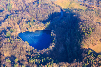 Quarry lake at Fischbachtal in the district Meßbach in Fischbachtal in the state Hesse, Germany seen from above