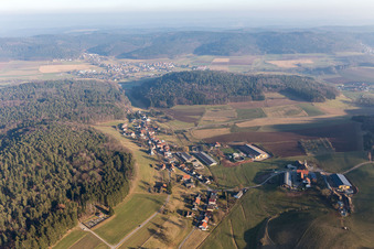 Aerial photograpy of Village - view on the edge of agricultural fields and farmland in Kocherbach in the state Hesse, Germany