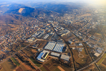 City view on the edge of the Odenwald between quarry and industrial area (Freudenberg GmbH) from the north in Weinheim in the state Baden-Wuerttemberg, Germany