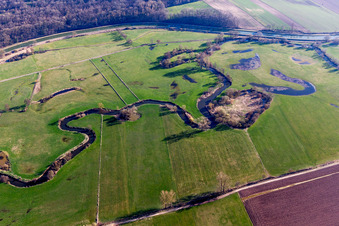Aerial view of Meandering, serpentine curve of a river Zorn in Hochfelden in Grand Est, France