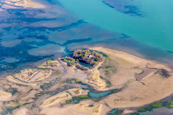 Marsh land, beaches and fishermens hut on the Isola Sant Andrea in the Lido of Grado near Lignano Sabbiadoro in Friuli-Venezia Giulia, Italy