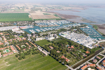 Aerial view of Pleasure boat marina with docks and moorings on the shore area of Marina Punta Gabbiani Aprilia Marittima in the district Aprilia Marittima in Bevazzana in Friuli-Venezia Giulia, Italy