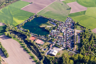 Camping with caravans and tents at a lake in Seltz in Grand Est, France