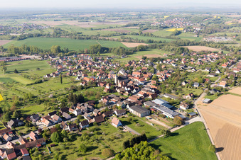 Aerial view of Village - view on the edge of agricultural fields and farmland in Gunstett in Grand Est, France