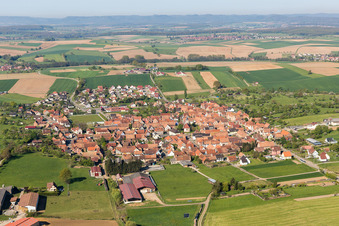 Aerial view of Village - view on the edge of agricultural fields and farmland in Uhrwiller in Grand Est, France