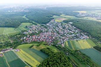 Village - view on the edge of agricultural fields and farmland in Uechtelhausen in the state Bavaria, Germany