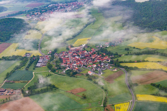 Village under clouds in the district Wustviel in Rauhenebrach in the state Bavaria, Germany