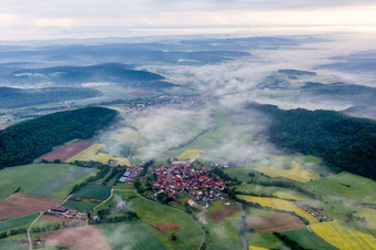 Forest and mountain scenery of Steigerwald in Fruehnebel in Wustviel in the state Bavaria, Germany