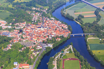 Village view on the banks of the Main from the east with Main Bridge for the B26 and Yacht Club Eltmann eV in Eltmann in the state Bavaria, Germany