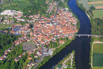 Village view on the banks of the Main from the east with Main bridge for the B26 in Eltmann in the state Bavaria, Germany